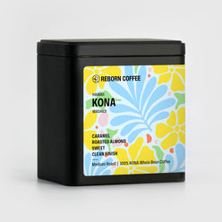 
                  
                    Black metal box with Kona Coffee beans inside. Sticker shows product info imposed on floral design. Front Left View, 1 of 7.
                  
                