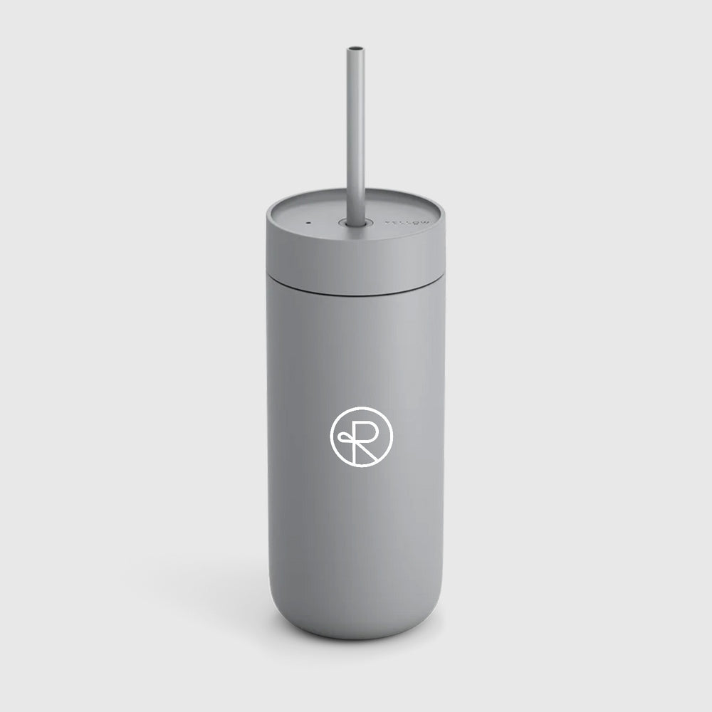 Grey colored Fellow tumbler with grey colored plastic straw, has Reborn Coffee circular logo imprinted on it. 1 of 4.
