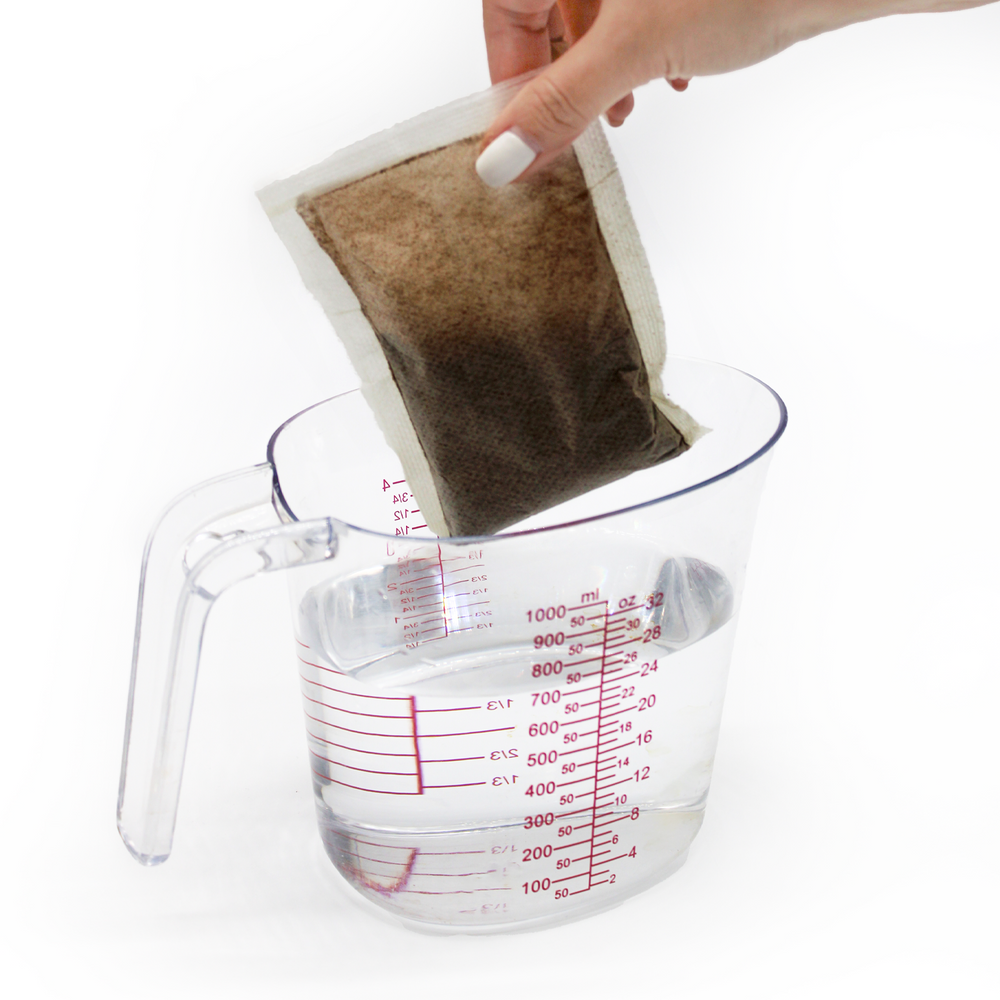 
                  
                    Cold brew pack being held over a pitcher of filtered water. 5 of 9.
                  
                