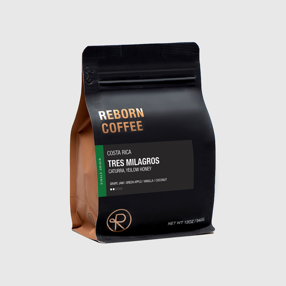 Reborn Coffee 12 oz coffee bag with information on Costa Rica Tres Milagros coffee beans. 