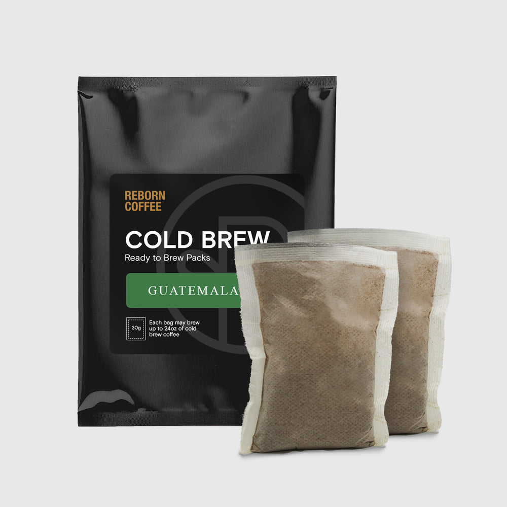 Guatemala Cold Brew Pack bag that has a sticker with product information. There are 2 Guatemala Cold Brew packs next to the bag. 1 of 9.