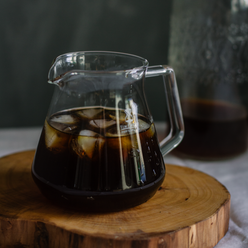 
                  
                    Cold brewed coffee in a timemore glass pitcher with ice cubes. Nearly empty pitcher of cold brew in background. 7 of 9.
                  
                