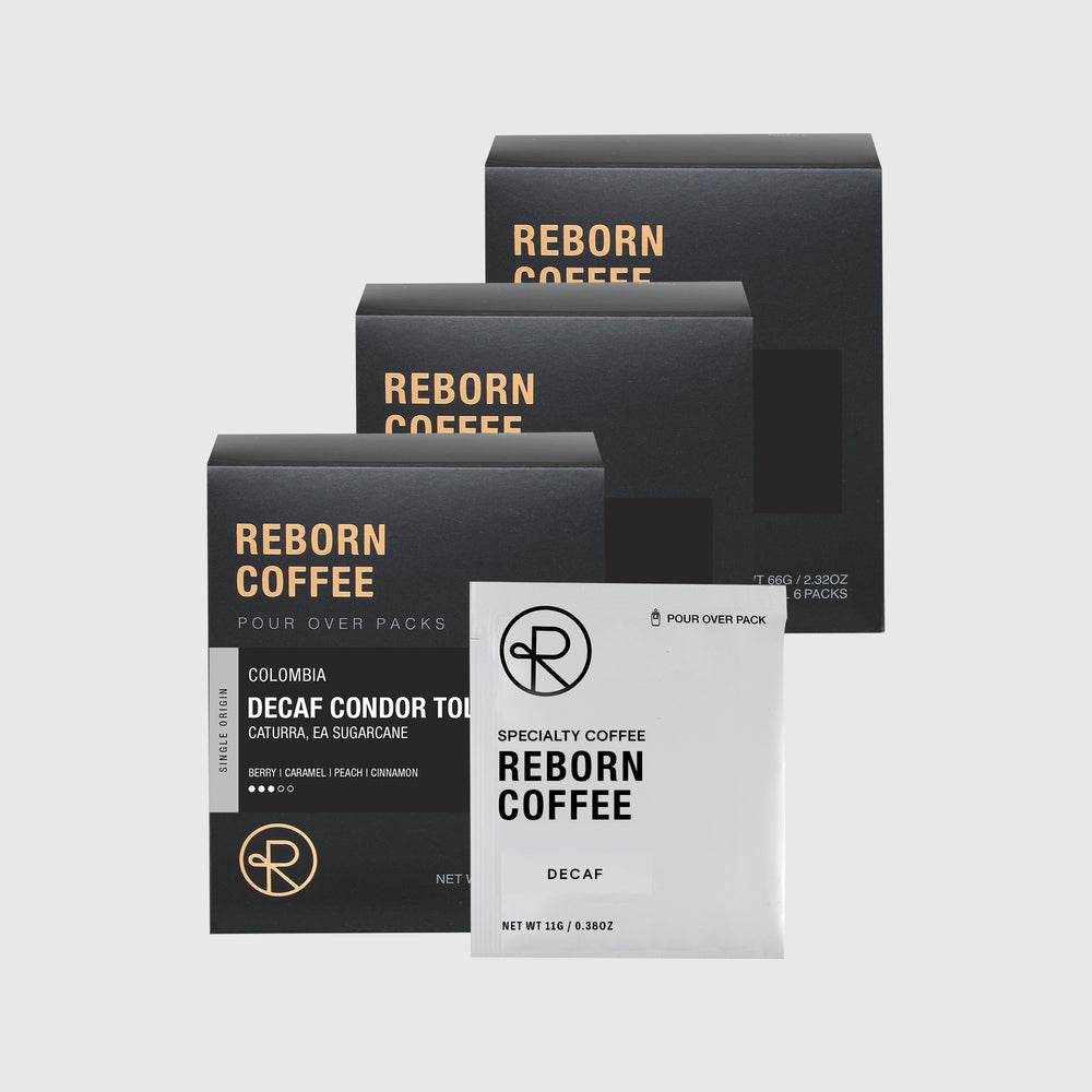 
                  
                    3 Colombia Decaf pour over pack boxes with product information on front stickers. Nitro sealed pour over pack bag next to the boxes. 3 of 6.
                  
                