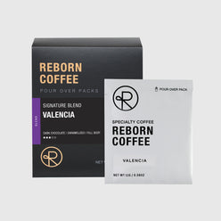 
                  
                    Valencia Coffee Bean blend pour over pack box with product information on front sticker. Nitro sealed pour over pack bag next to box. 1 of 6.
                  
                