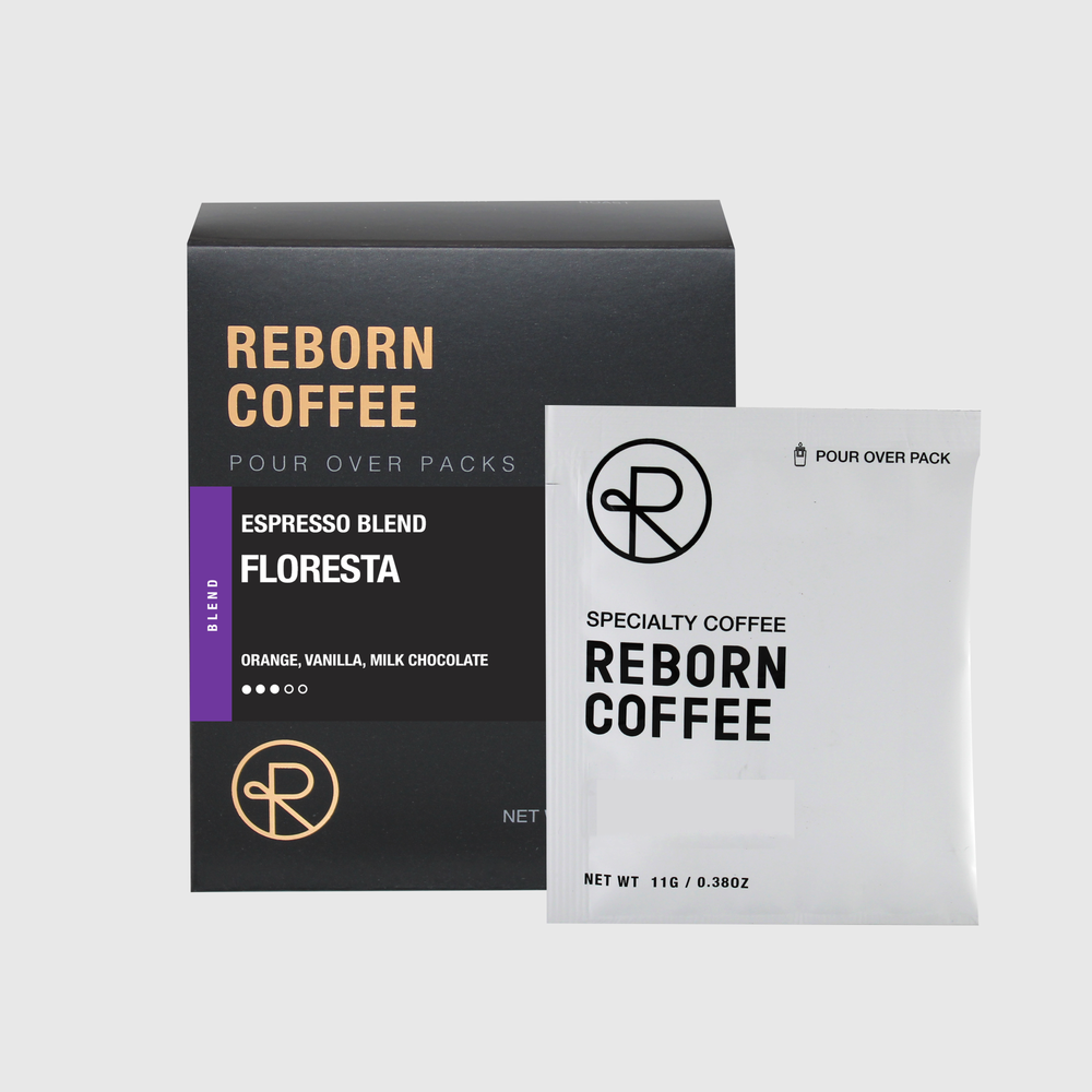 Floresta coffee bean blend pour over pack box with product information on front sticker. Nitro sealed pour over pack bag next to box. 1 of 6.